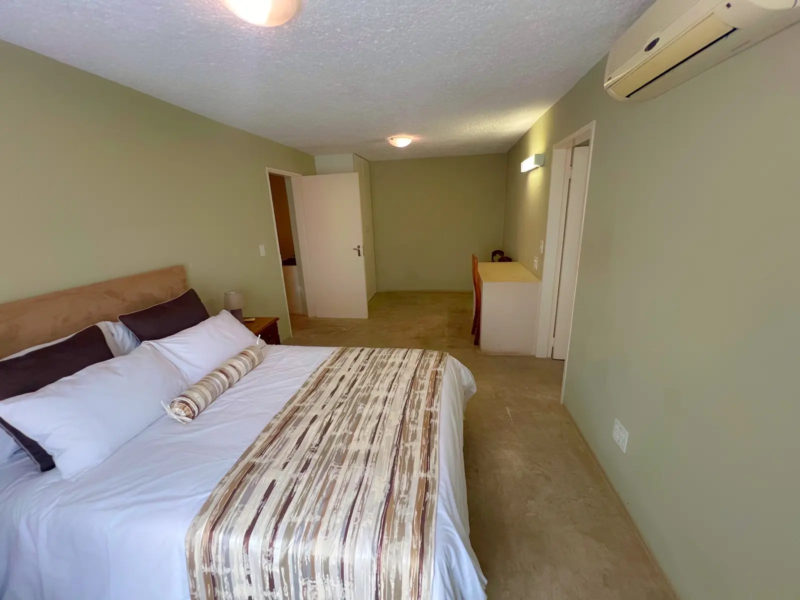 A twin-bedded room with air-conditioning.