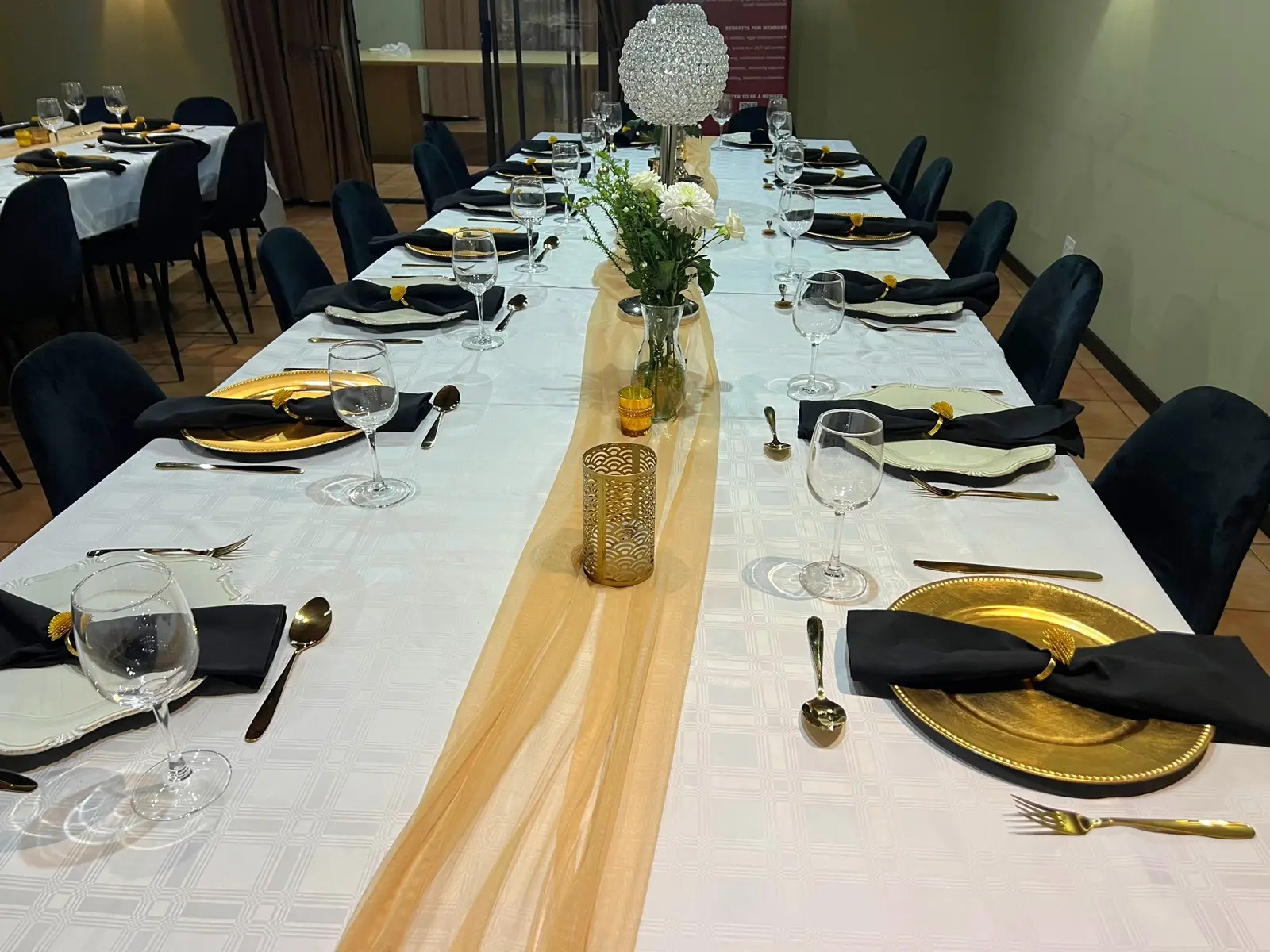 A long dining table set for a celebration meal.