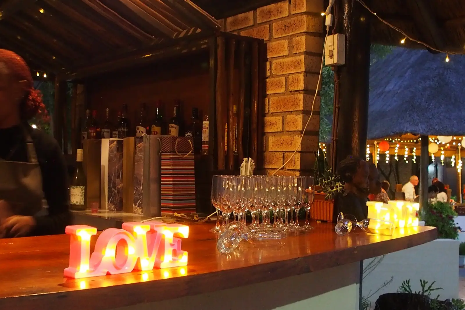 The lodge bar lit for a celebration at night.